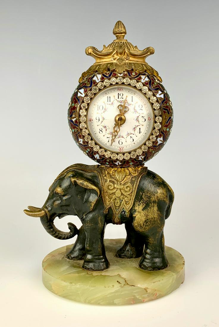 Champleve Enamel & Bronze Elephant Clock C. 1900: Unusual champleve enamel and bronze clock supported by an elephant standing on a green onyx base, dial has rhinestone frame, not in running condition, 7.5" height *Clocks and watches are not guarantee