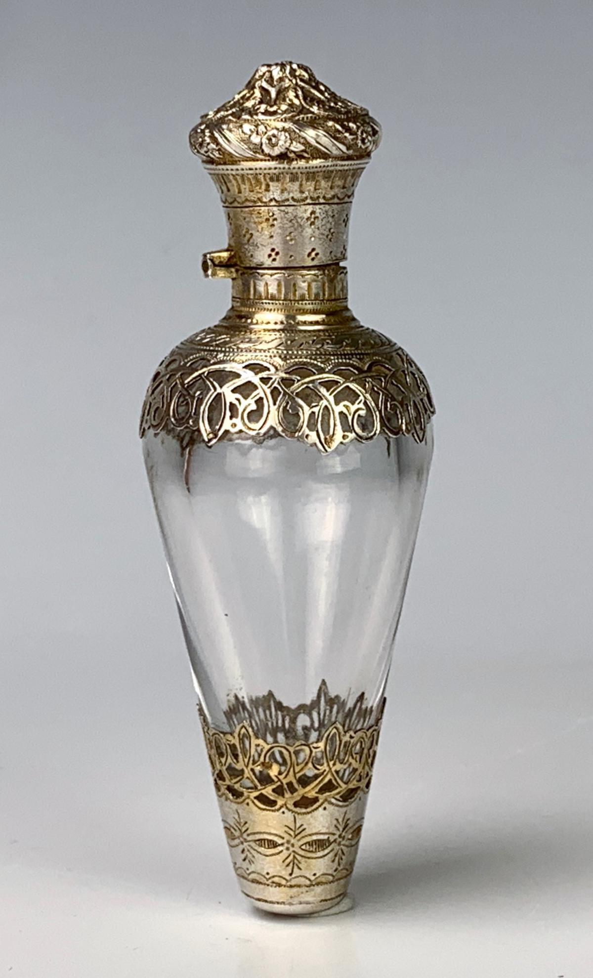 Amphora Shaped Silver & Crystal Perfume Bottle: Late 19th century, having a clear crystal body and decorated with ornate silver work top and bottom, silver hallmarks, very good condition, 3.25" length