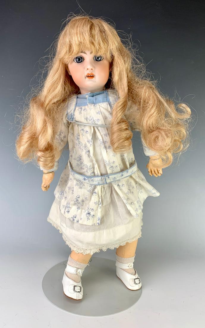 17" French Tete Jumeau Doll C. 1890: Open mouth with teeth, blue paperweight eyes, bisque head, marked "Tete Jumeau" in red ink, French composition and wood body with "Bebe Jumeau Diplome D'honneur" sticker on rear, one finger is broken 