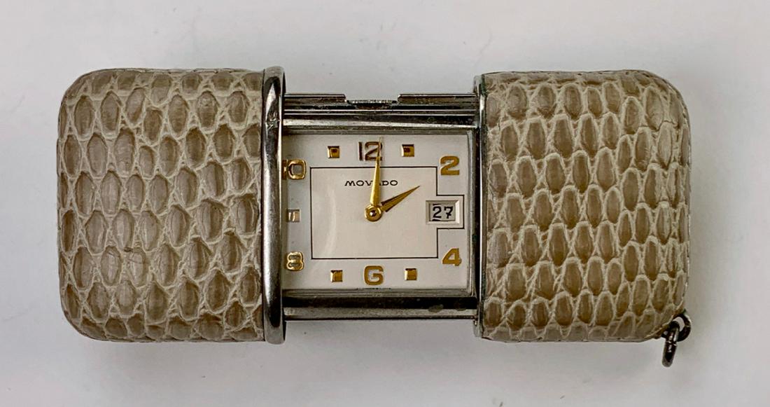 Vintage Movado Ermeto Snakeskin Traveling Watch: Circa 1950 Ermeto watch in sliding snakeskin case, dial marked "Movado", with calendar date, in running order and in very good condition, 1" x 1.67"*Video available upon request*