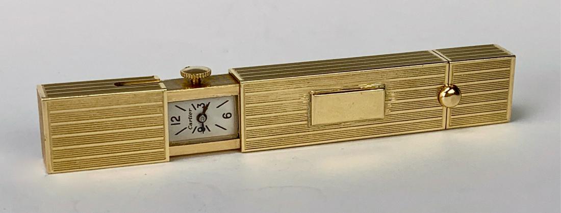 Art Deco Signed 14k Cartier Ladies Lipstick with Watch: Having a long rectangular body, one side opens up to reveal a watch, signed "Cartier", other side opens to reveal a lipstick holder, serial number 20026, good condition, 2.75" length *All watches are 