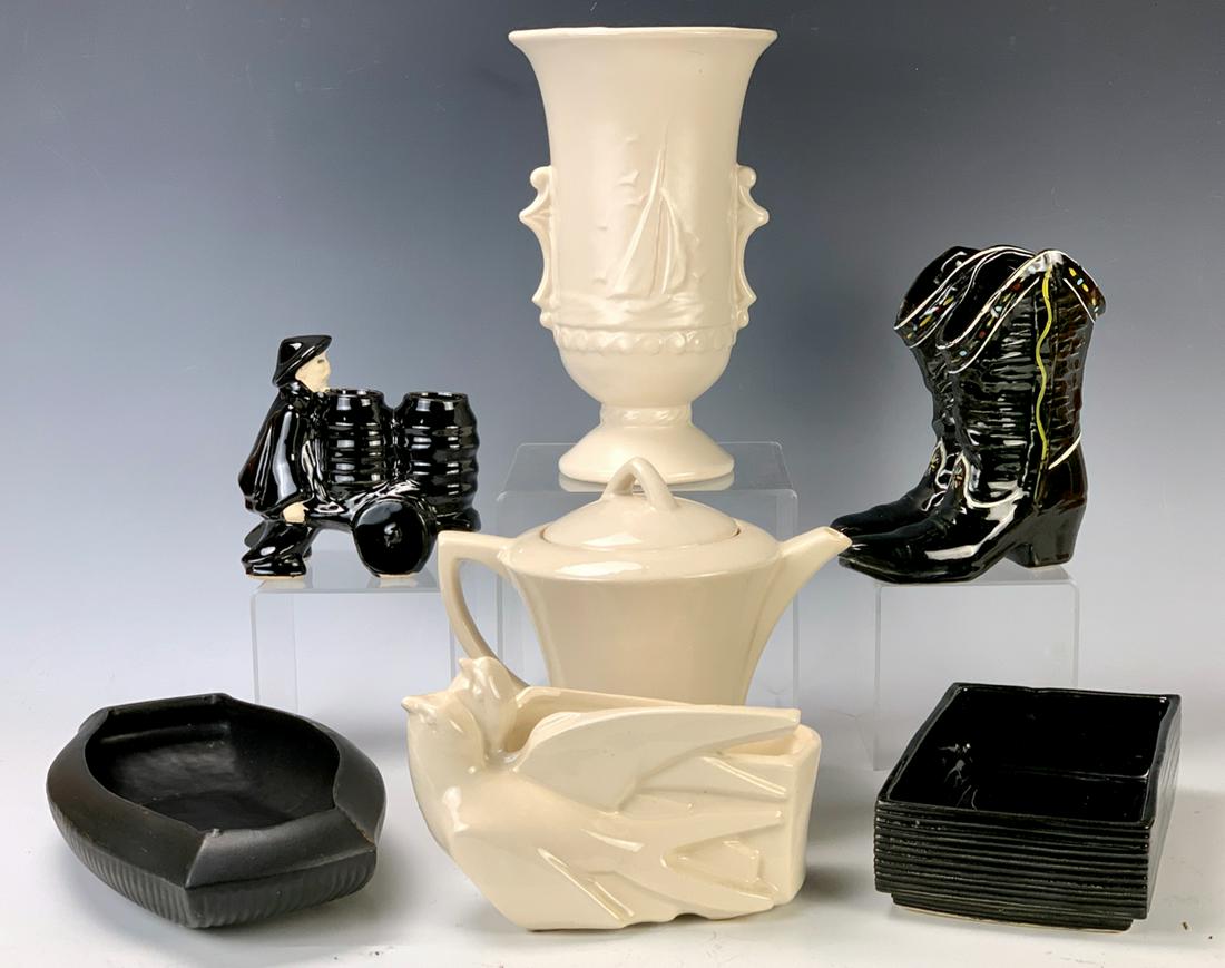 Lot of 7 Misc. McCoy Pieces: Consisting of vase with ships, cowboy boots, teapot, 2 low bowls, 1 bird planter and interesting Oriental planter, good condition, 9" largest