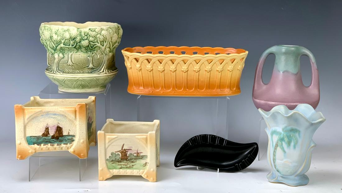 Lot of 7 Pottery Pieces Roseville, Weller, Etc.: Wonderful deco Weller Classic reticulated window box, rare Brush McCoy vase with complex mold with trees, Weller palm tree vase, Roseville ashtray, 2 early Roseville planters with ship and windmill de
