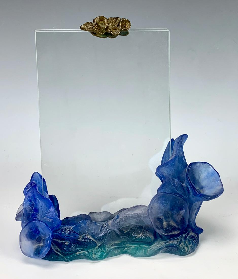 Daum France Pate de Verre Art Glass Frame: Having a blue pate de verre glass floral base with clear glass plates and a bronze floral decoration at the top, signed "Daum France", very good condition, 9" x 8"