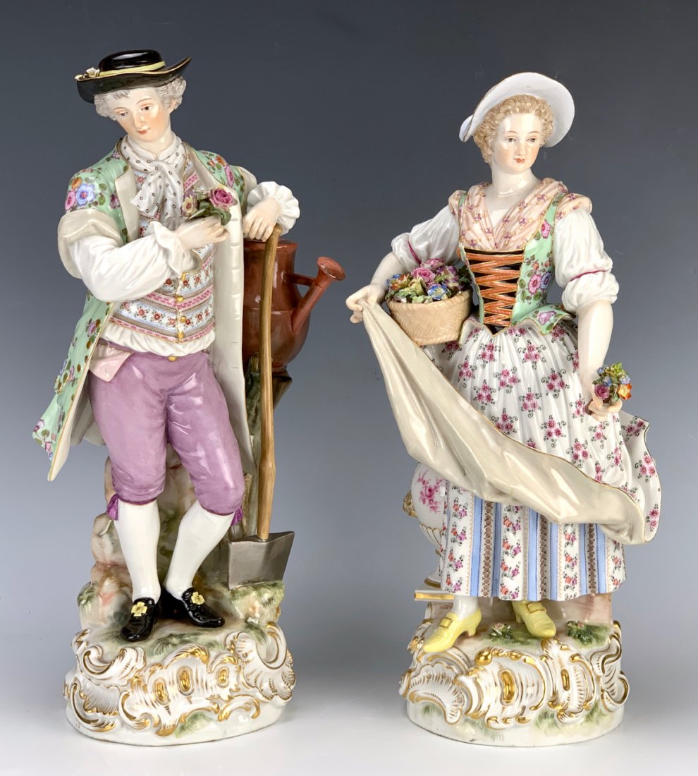 Pair of Large Meissen Porcelain Figurines: Beautiful pair of 19th century Meissen porcelain figurines modeled by Michael Victor Acier (1736-1799), the first of female gardener holding flowers and the other of a male gardener also holding flowe