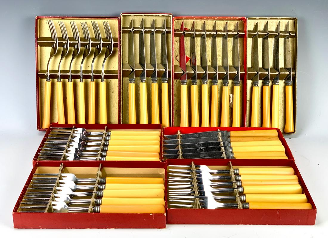 Large Group of Bakelite Handled Knives & Forks: Circa 1930, large lot of 20 knives and 23 forks, all with yellow bakelite handles, knives marked "Sharp Cutter Cutlery Company Stainless Steel" on blades, forks marked "Stainless Steel", good conditio