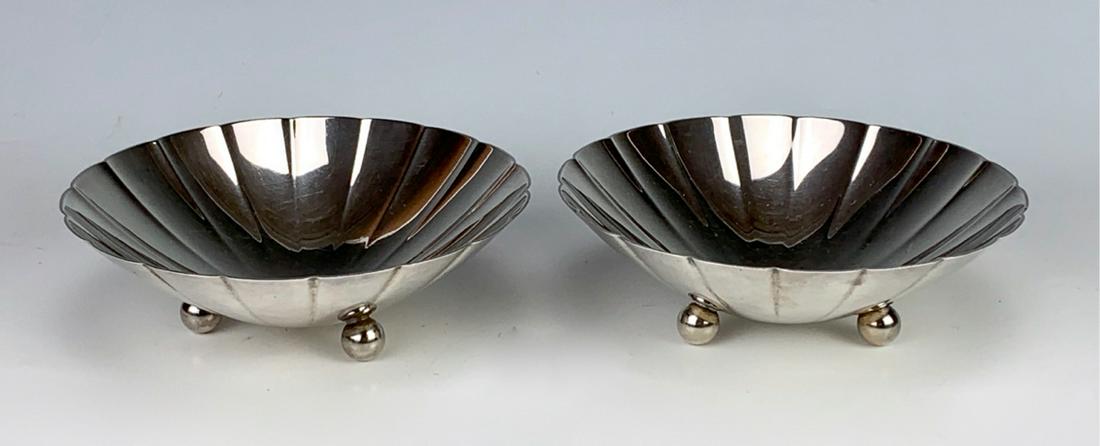 Pair Tiffany & Co. Sterling Silver Dishes: Pair of Tiffany & Co. sterling silver dishes with scalloped pattern seated on 3 ball feet, marked "Tiffany & Co. Makers, Sterling Silver 22673M", 460 grams, 14.78 troy ounces, very good condition, 2" 