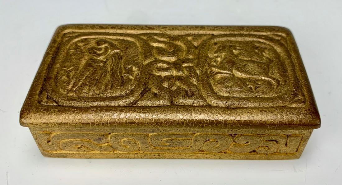 Tiffany Studios Bronze "Zodiac" Stamp Box: Gilt bronze zodiac pattern stamp box, signed"Tiffany Studios New York 802", very good condition, normal wear to patina commensurate with age, 3.75" x 1.75" x 1"