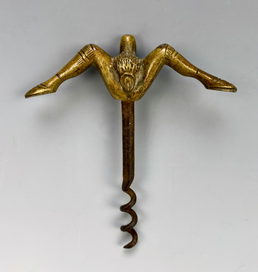 Antique Erotic Corkscrew C. 1900: Gilded bronze corkscrew depicting spread legs, handle with male and female genitalia on opposite sides and having an iron corkscrew, very good condition, 3.75" length