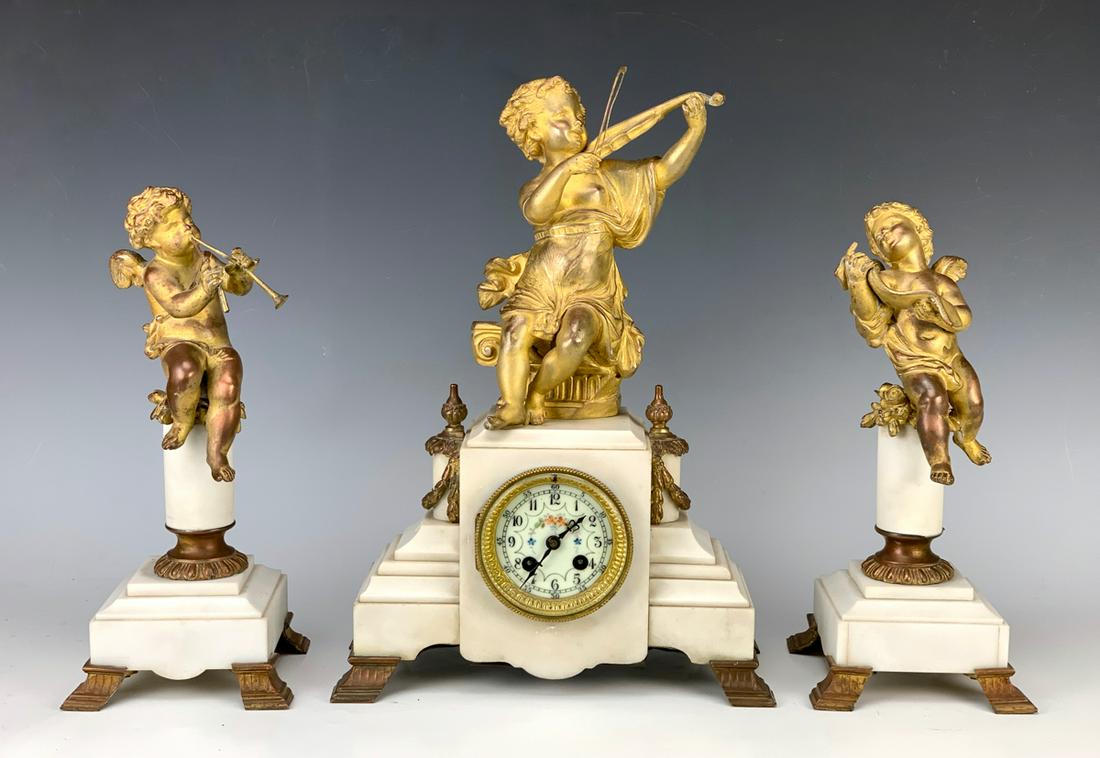 3pc French Gilt Bronze "Musicians" Clock Set: Late 19th century, having 3 gilt bronze musical theme putti mounted on alabaster bases, fair condition, one putti has bent flute and tip missing, wear to gilt commensurate with age, 15" tallest