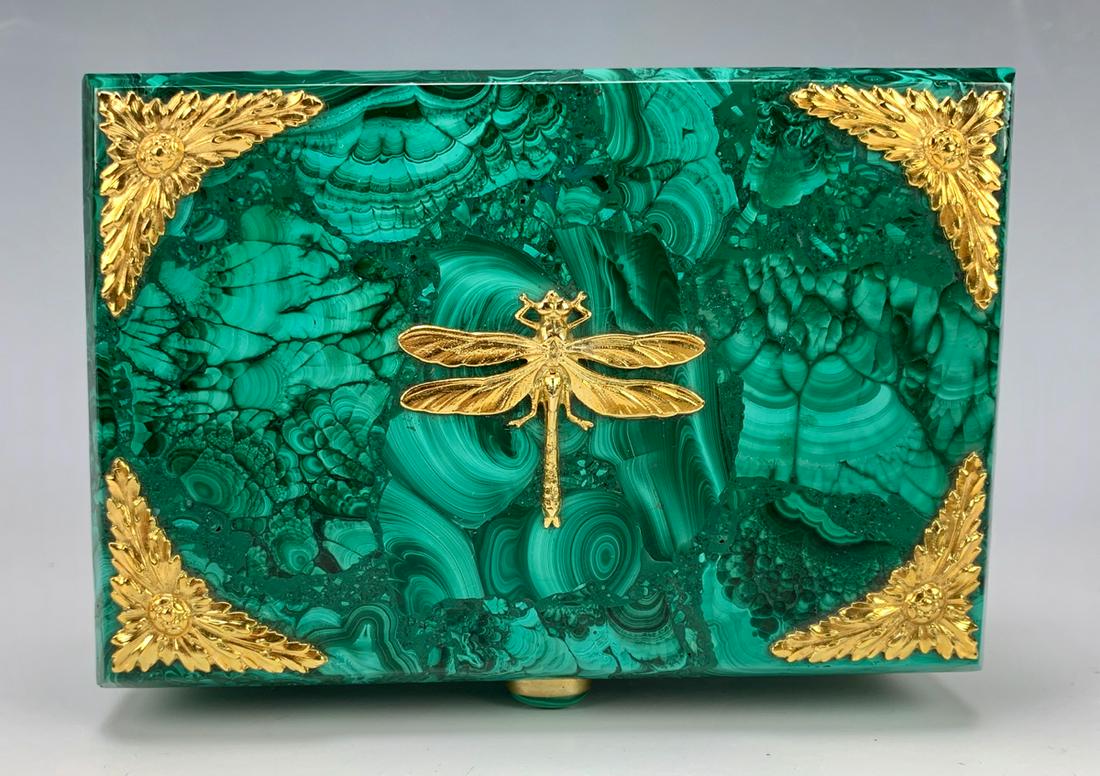 Fine Malachite Box w/ Gilt Bronze Dragonfly: Very fine quality malachite box decorated with a gilt bronze, dragonfly top center and decorative corners as well as the feet, has a hinged lid with a gold gilt chain, very good condition, 6" x 4" x 3