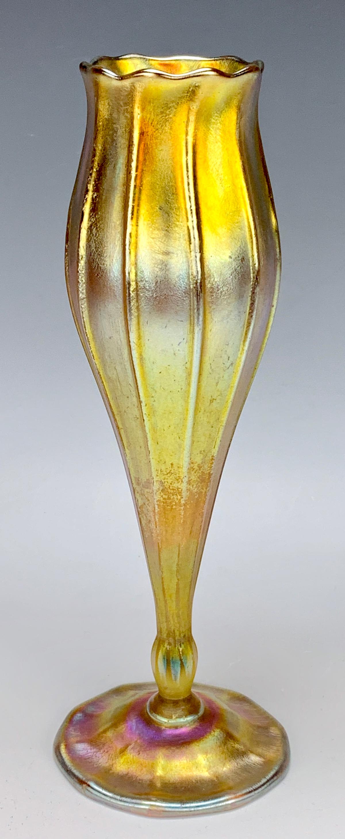 Tiffany Studios Favrile Floriform Vase: Having a gold favrile art nouveau vase, signed "L.C. Tiffany Favrile 182E", good condition, light scratches and wear, minor oxidation. 10.75" height