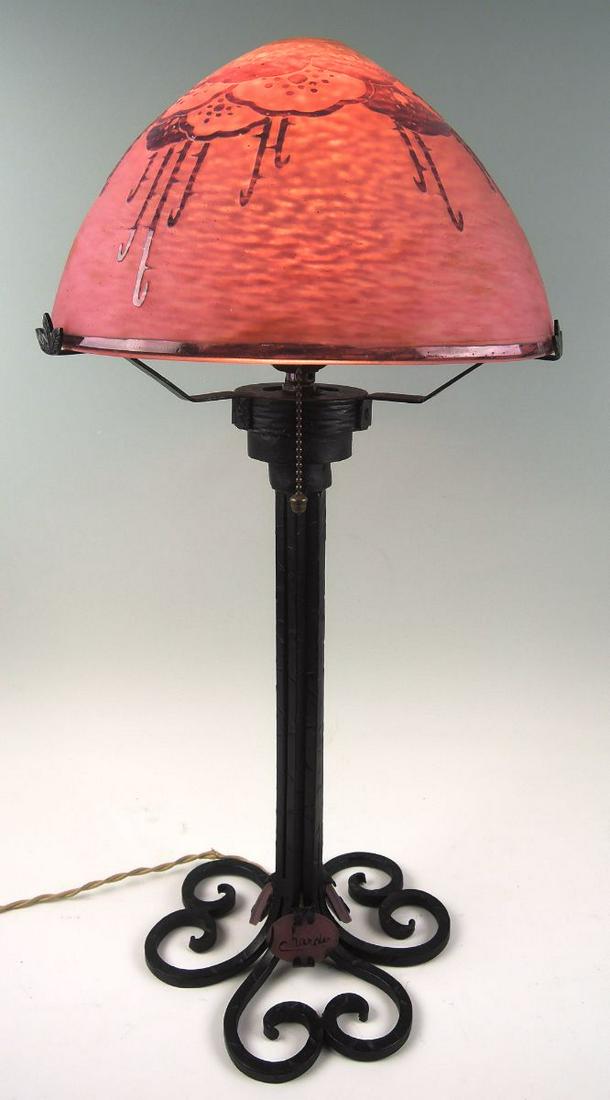 Le Verre Francais Charder Cameo Glass Table Lamp: Circa 1920, signed in cameo and engraved "Charder", the domed shade with overlaid and acid cut stylized floral design in purple against a mottled pink ground, patinated cast iron art deco base with mo