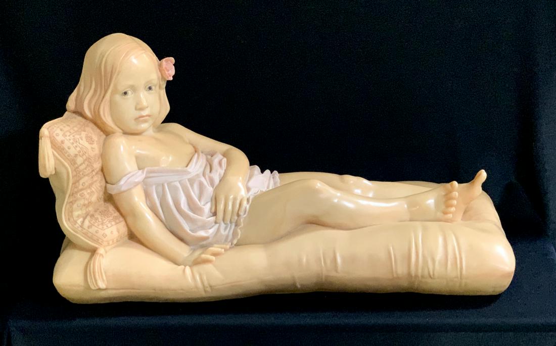 Emily Kaufman (20th C.) "Girl on Couch" 1982: Having a young girl on a couch made of resin in a large size, signed "E. Kaufman 1982", born in New York City in the 1950's, her collegiate fine arts studies brought a BFA from Boston University and a