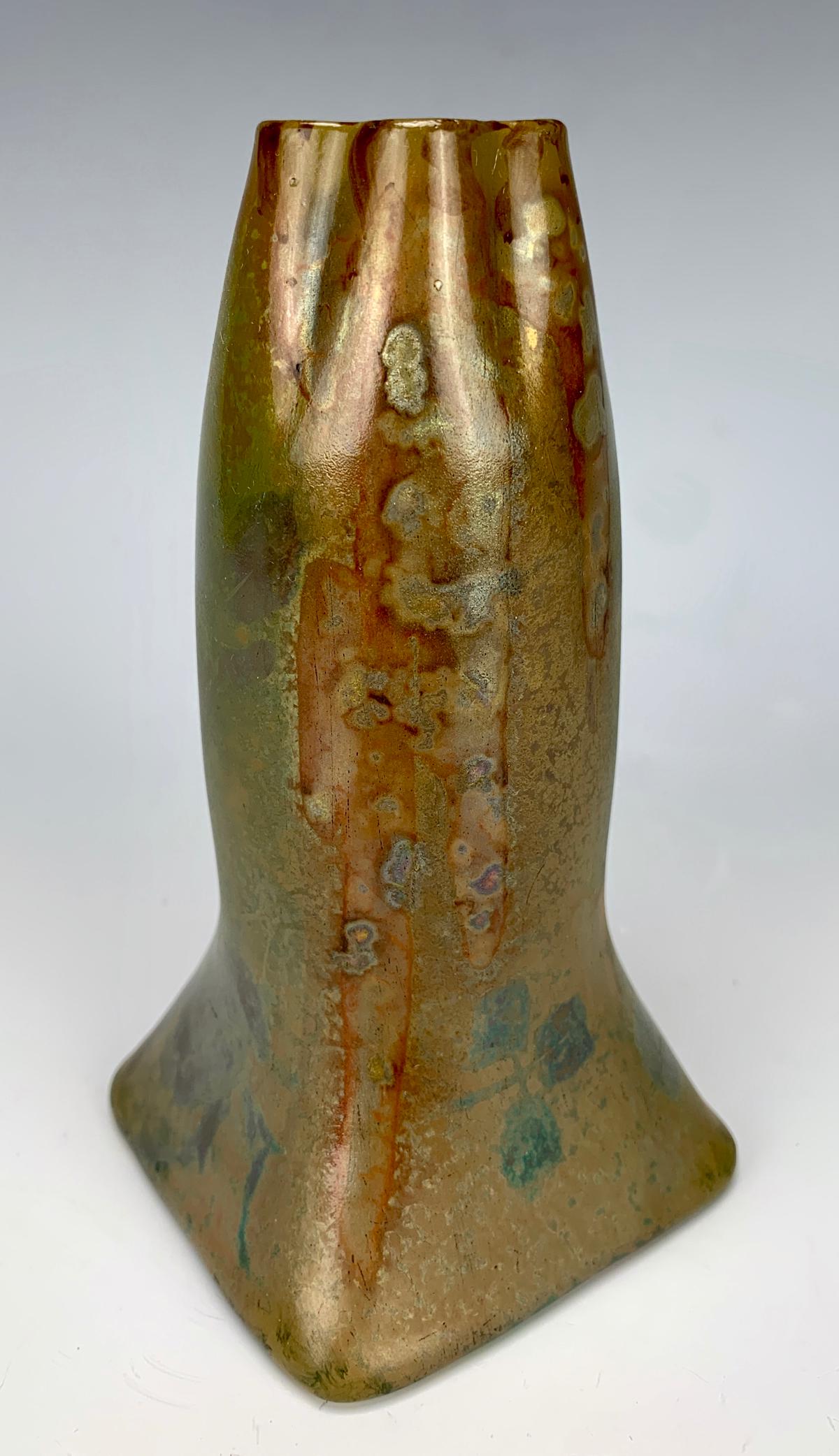 Sgd Clement Massier Iridescent Vase: Art nouveau shaped vase in colors of red, green and gold iridescence, signed, good condition, minor rim repair, 5.375" height