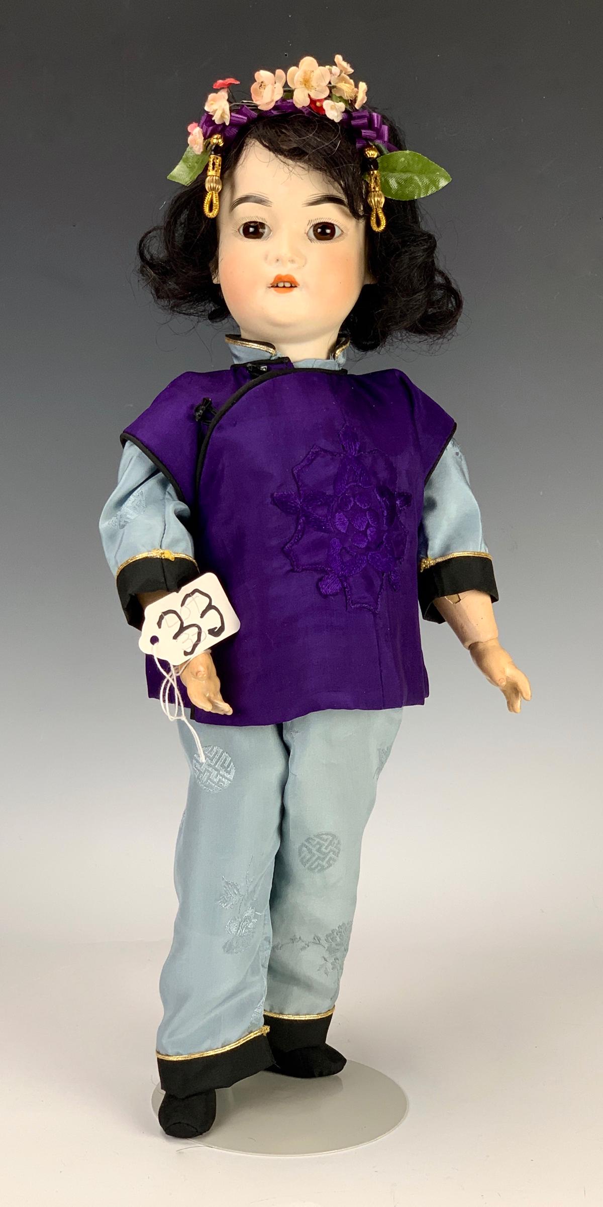 17" Schoenau & Hoffmeister Asian Bisque Head Doll: Cira 1900, Germany, brown set glass eyes, open mouth with teeth, fully jointed composition body, clothing made from vintage fabric, antique wig, marked "S", "PB" (in star), "H 4900", very good to exce