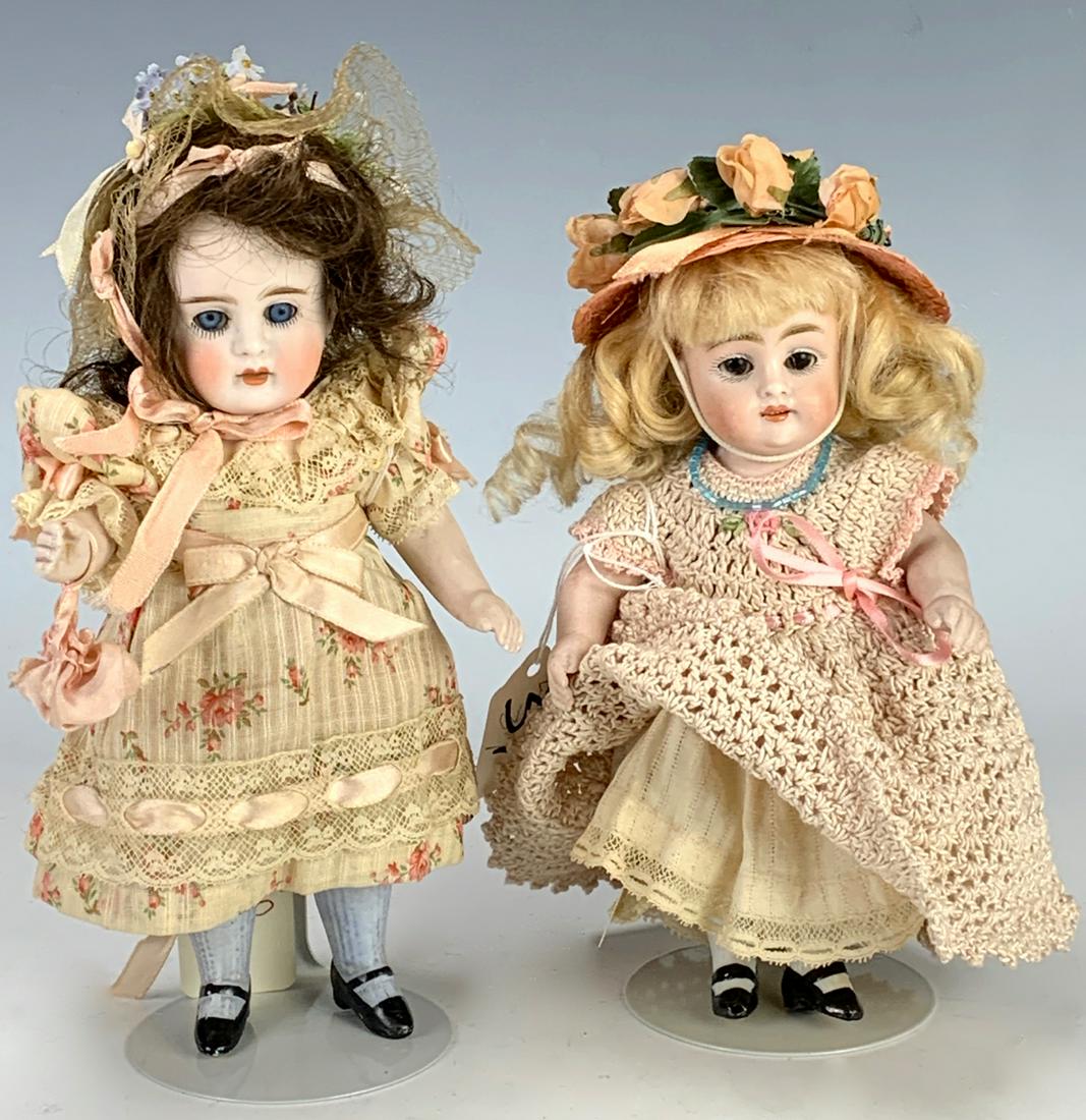 2 Kestner All Bisque 150 Stiff Neck Dolls C. 1890: 8" with brunette hair, blue sleep eyes, blue molded stockings, original pate, antique clothing, circa 1890, open mouth with teeth, 7" with blond mohair wig, brown sleep eyes, open mouth with teeth, ve