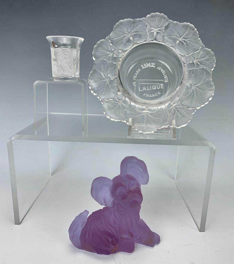 Lalique, France: Consisting of an advertising ashtray inscribed "To years Linz Jewelers, Lalique France", dog figurine and shot glass signed "Lalique France", very good condition, 6" largest diameter