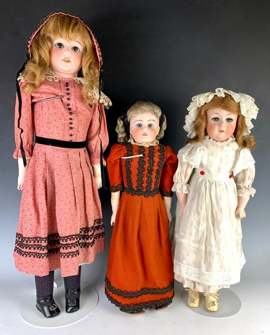 Lot of 3 German Bisque Shoulder Head Dolls: All with open mouths with teeth, 27" Schoenau & Hoffmeister child with brown glass sleep eyes, rivet jointed leather body with bisque forearms, some sawdust leakage, antique human hair wig, 20" unmark