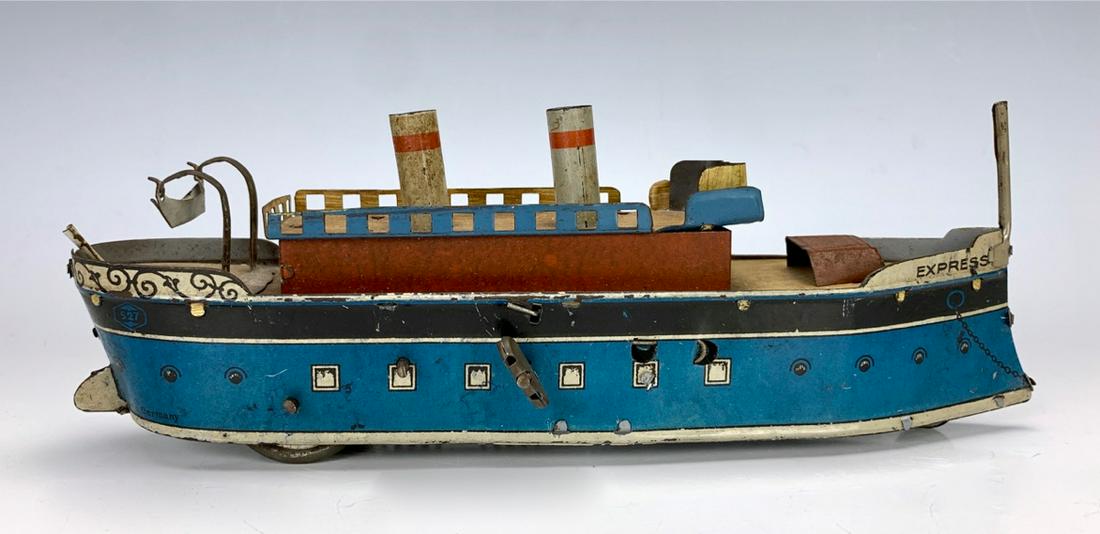 Express Tin Clockwork Toy Boat (Germany): Blue tin body with double smoke stacks, made in Germany, good condition, 9" x 3.25" *Mechanics are not guaranteed*