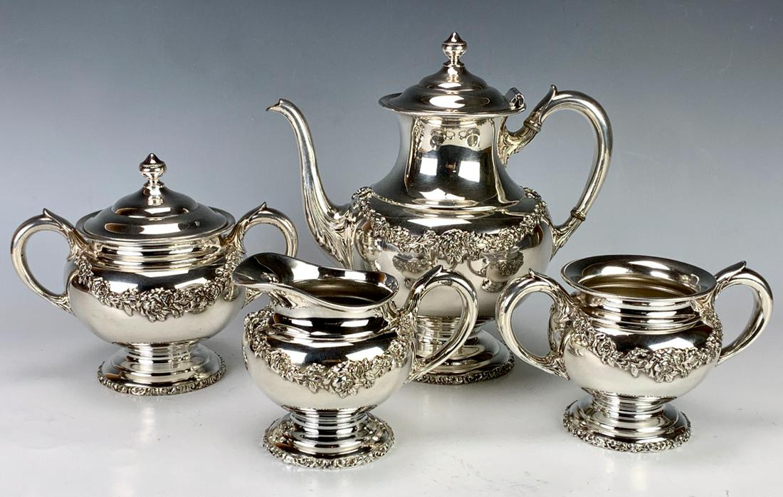 4 Piece Silverplate Tea Service by A.J. Jordan: Consisting of a teapot, creamer, sugar and waste bucket, marked with A.J. Jordan Silverplate Co. logo, couple very slight dents, 9" tallest