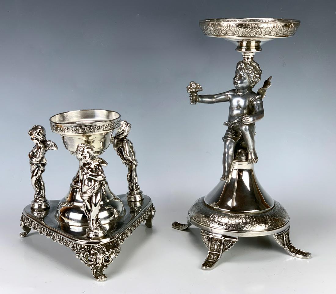 Pair Silverplate Figural Compote Bases: Offering 2 nice figural silverplate compote bases, one has 3 cherub figures made by Florence SP Co. and the other having a putti holding flowers with Meridan silver mark, good condition, 11.25" talles