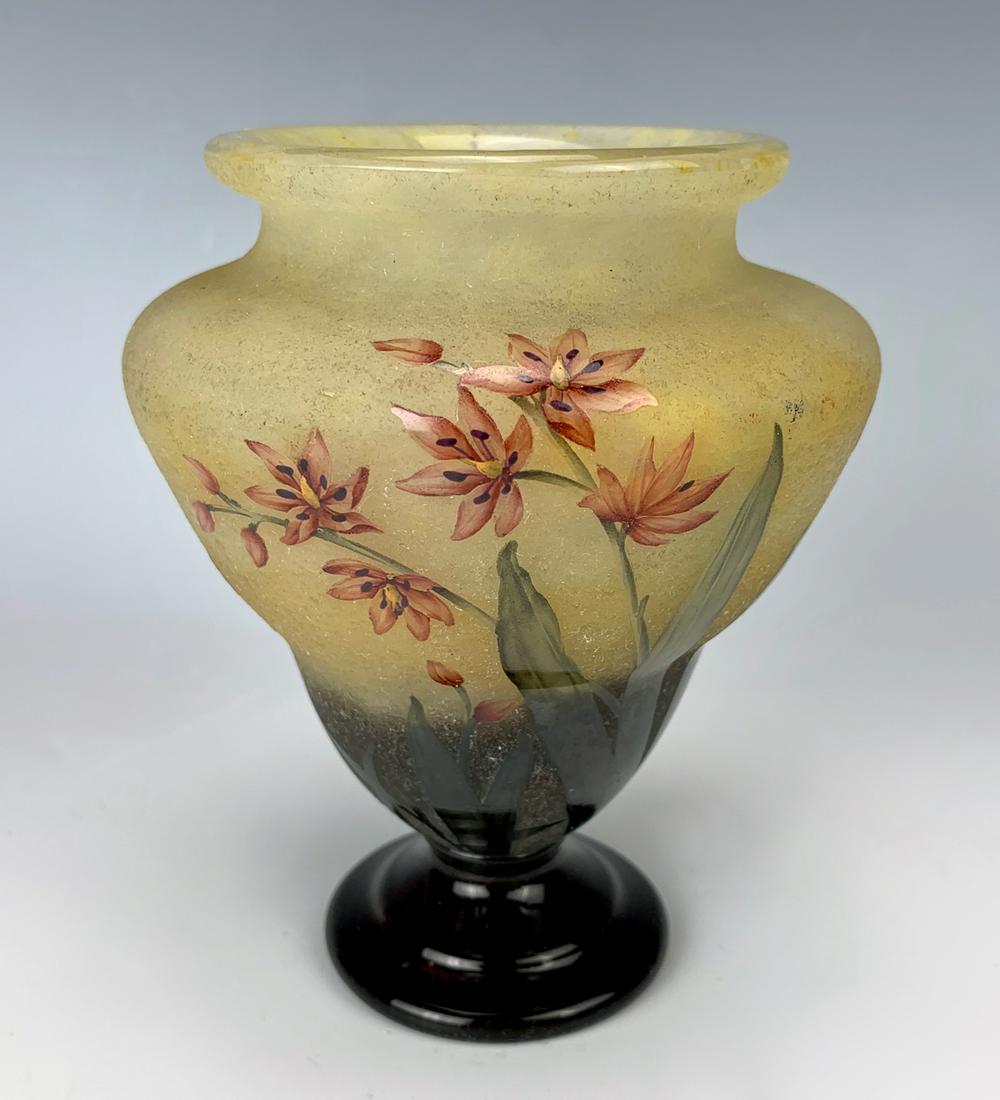 Daum Nancy Cameo Glass Vase C. 1900: Beautiful cameo glass vase signed "Daum Nancy" with cross of Lorraine, pear shaped vase on flared neck on pedestal, yellow frosted glass body decorated with kaffir lilies, very good condition, 5.375"