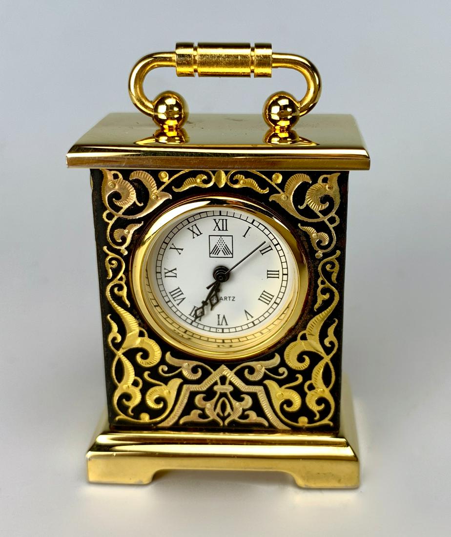 Amfrana Miniature Quartz Carriage Clock: Amfrana miniature quartz carriage clock, good condition, 1.75" height **Most clocks in running condition at time of auction. Contact us for detailed condition report***Clock and watches are not guaran