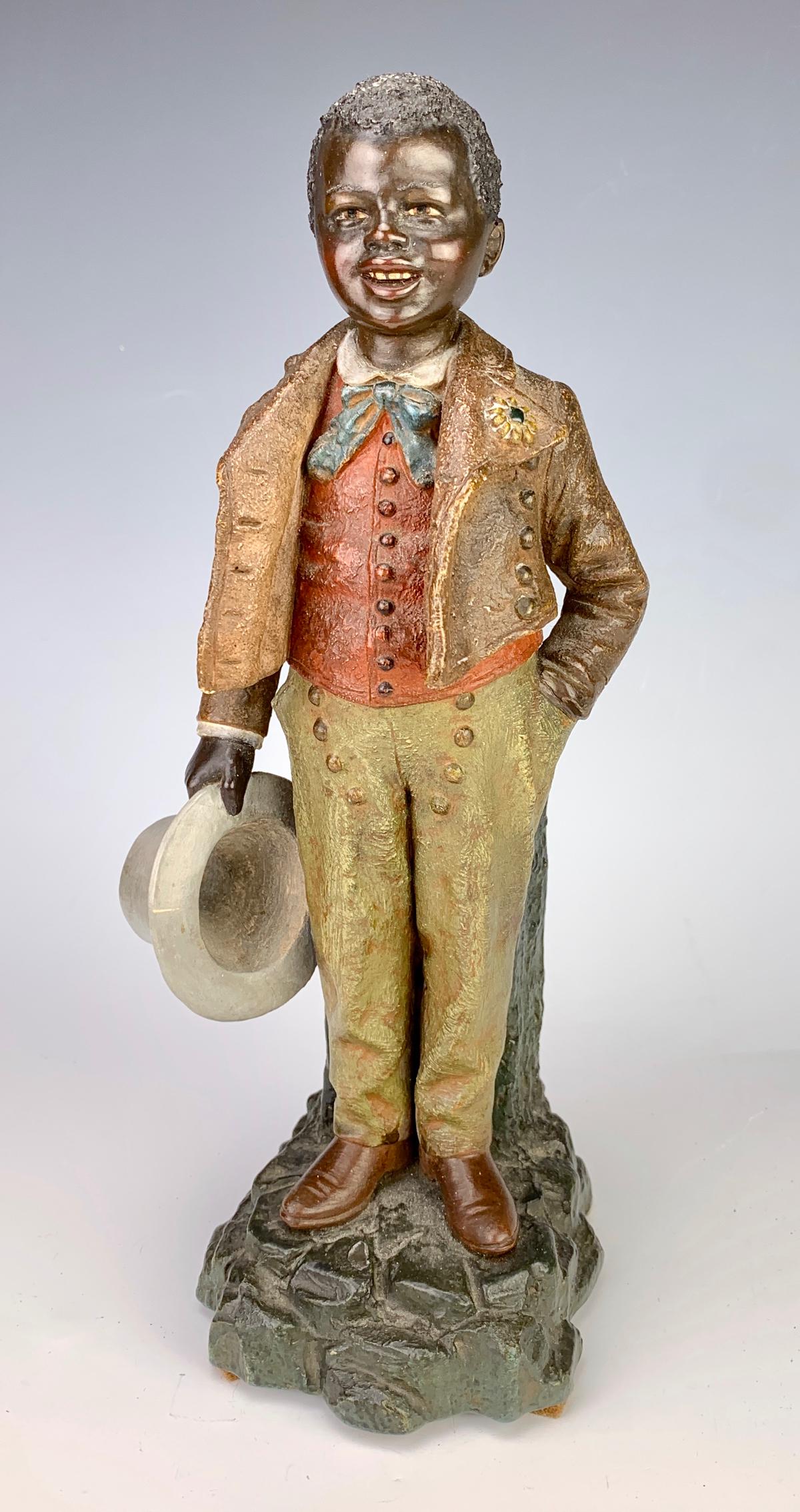 Bernard Bloch Black Americana Boy with Top Hat: Circa 1900, made in Austria, terra cotta black boy holding his top hat at his side, marked on bottom "BB 4323", very good condition, 11" height