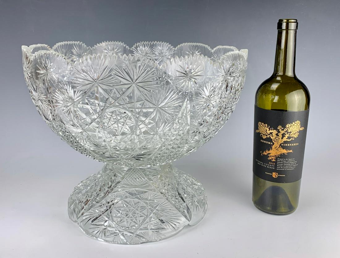 Large Cut Glass Pedestal Punch Bowl: Beautiful large cut glass pedestal bowl with a 6 point start design in center, basically very good condition, couple minor flakes on teeth, 10" height, 13" diameter