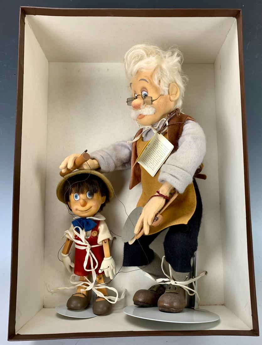R. John Wright Gepetto & Pinocchio with Box: R. John Wright Gepetto and Pinocchio with original box, 244/500, 16" height **Most dolls are in like new condition but contact us for detailed condition reports. All lots offered are sold "As-Is".****