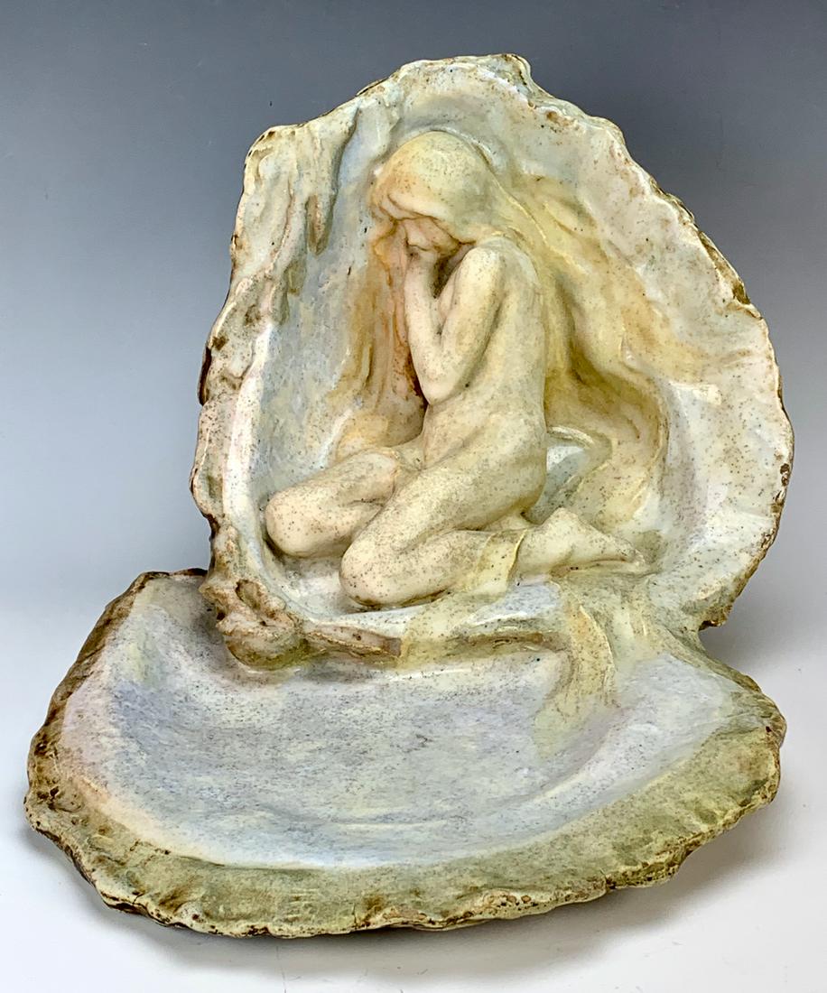 Edmond Lachenal (1855-1948) "Nude in Shell": Wonderful art nouveau vide poche pottery figure of a nude lady sitting in a seashell with the bottom of the shell in front of her, has matte and shine glaze over a light blue color, signed "Lachenal",