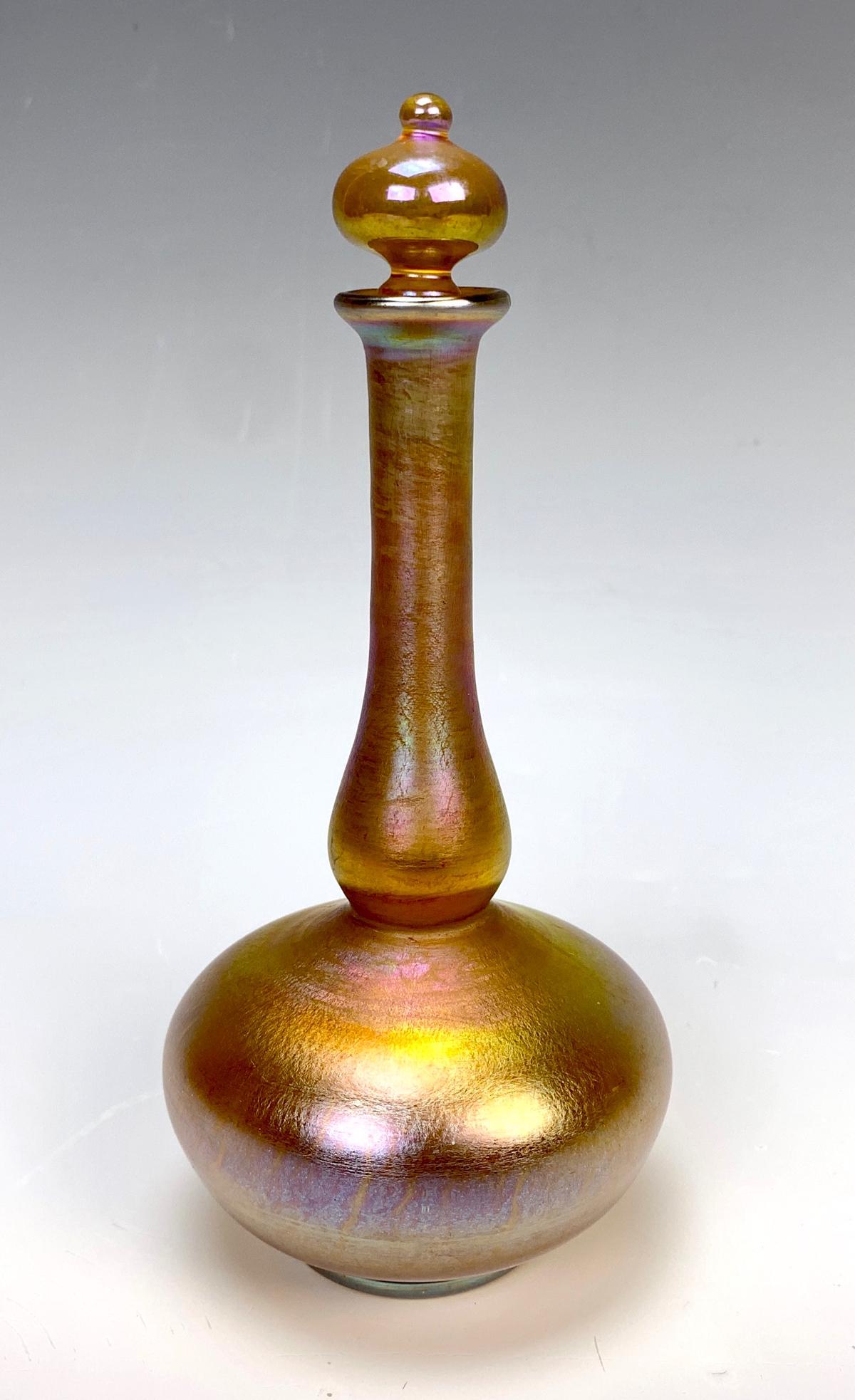 Tiffany Studios Favrile Perfume Bottle: Signed "L.C. Tiffany Inc. Favrile 1055-1006N" in a gold iridescence, very good condition, no problems, 6.5" height