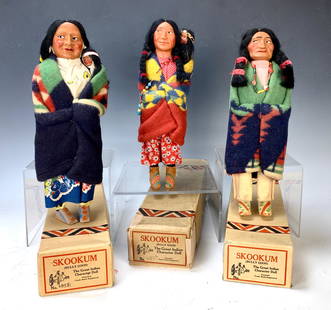 Group of 3 American Indian Skookum Dolls: Group of 3 American Indian Skookum Dolls. All in their original boxes, two of them female w/ papoose babies. Elderly doll is tallest at 13 1/2". Very good condition. Lifetime Collection of Sharon