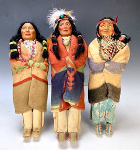 Group of 3 American Indian Skookum Dolls: Group of 3 American Indian Skookum dolls. Two are marked under foot and female w/ papoose baby. Tallest 16". Very good condition. Lifetime Collection of Sharon McDowell, Simi Valley, CA