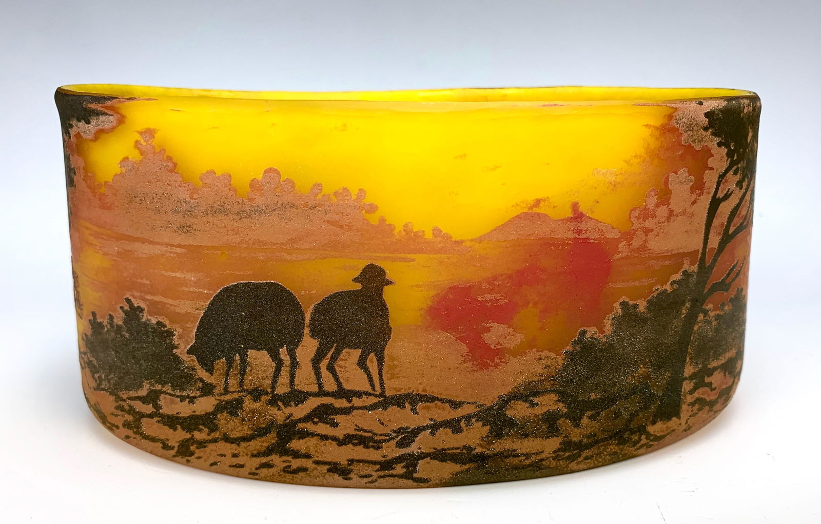 Muller Freres Luneville Scenic Cameo Glass Vase: Having an oblong cameo glass bowl depicting a sheep herder and his sheep, signed.. 3.75" tall x 7.5" wide x 4.5". Condition: Good.