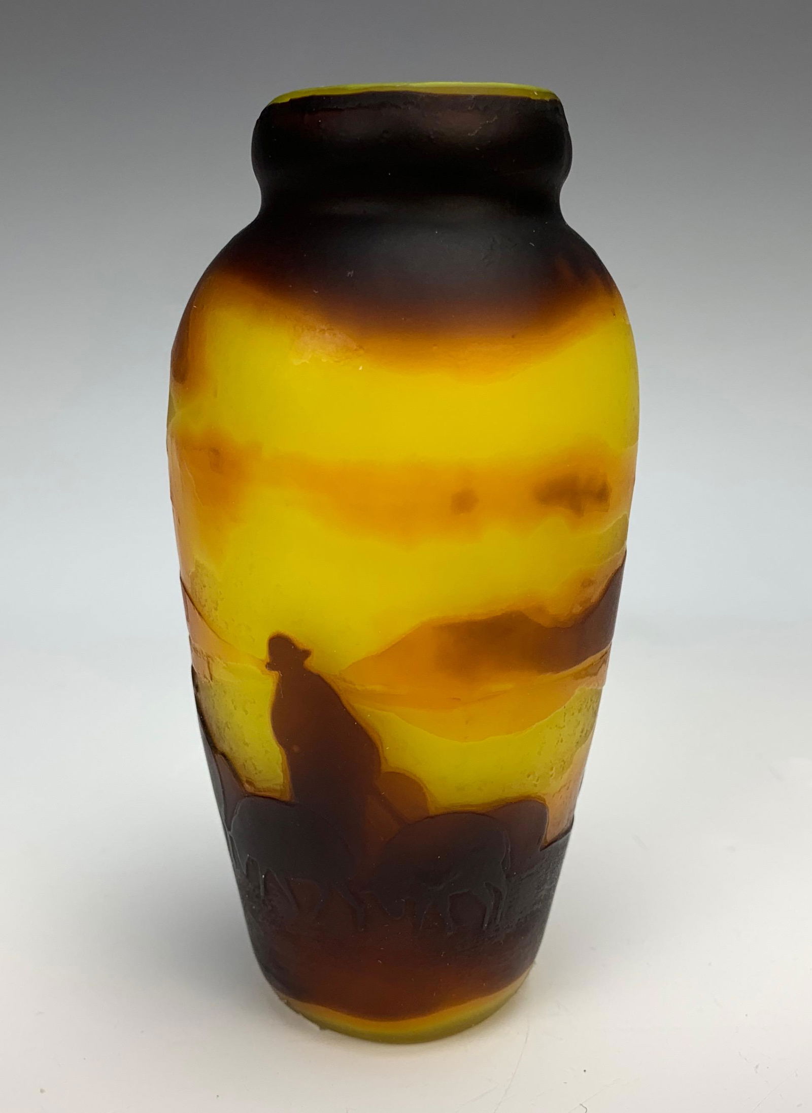 Muller Freres Luneville Scenic Cameo Glass Vase: Small cameo glass vase signed Muller Freres Luneville. Depicting sheep herder & sheep in yellow and dark red., signed. 5" tall. Condition: Good!
