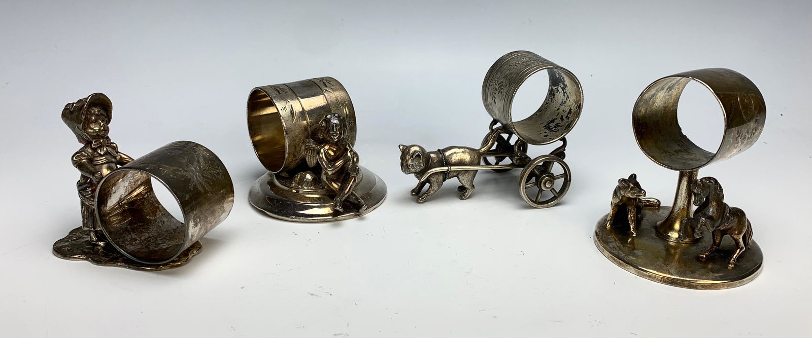 Four Victorian Figural Napkin Rings (1 of 1)