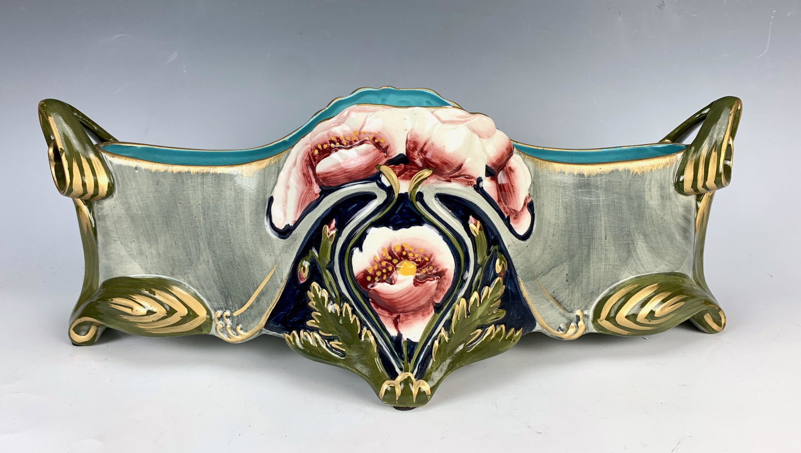 Sarreguemines Majolica Faience Planter: Circa 1900, nice art nouveau double handled majolica planter with floral decoration, marked and numbered, good condition, 16.5" x 6" x 8"