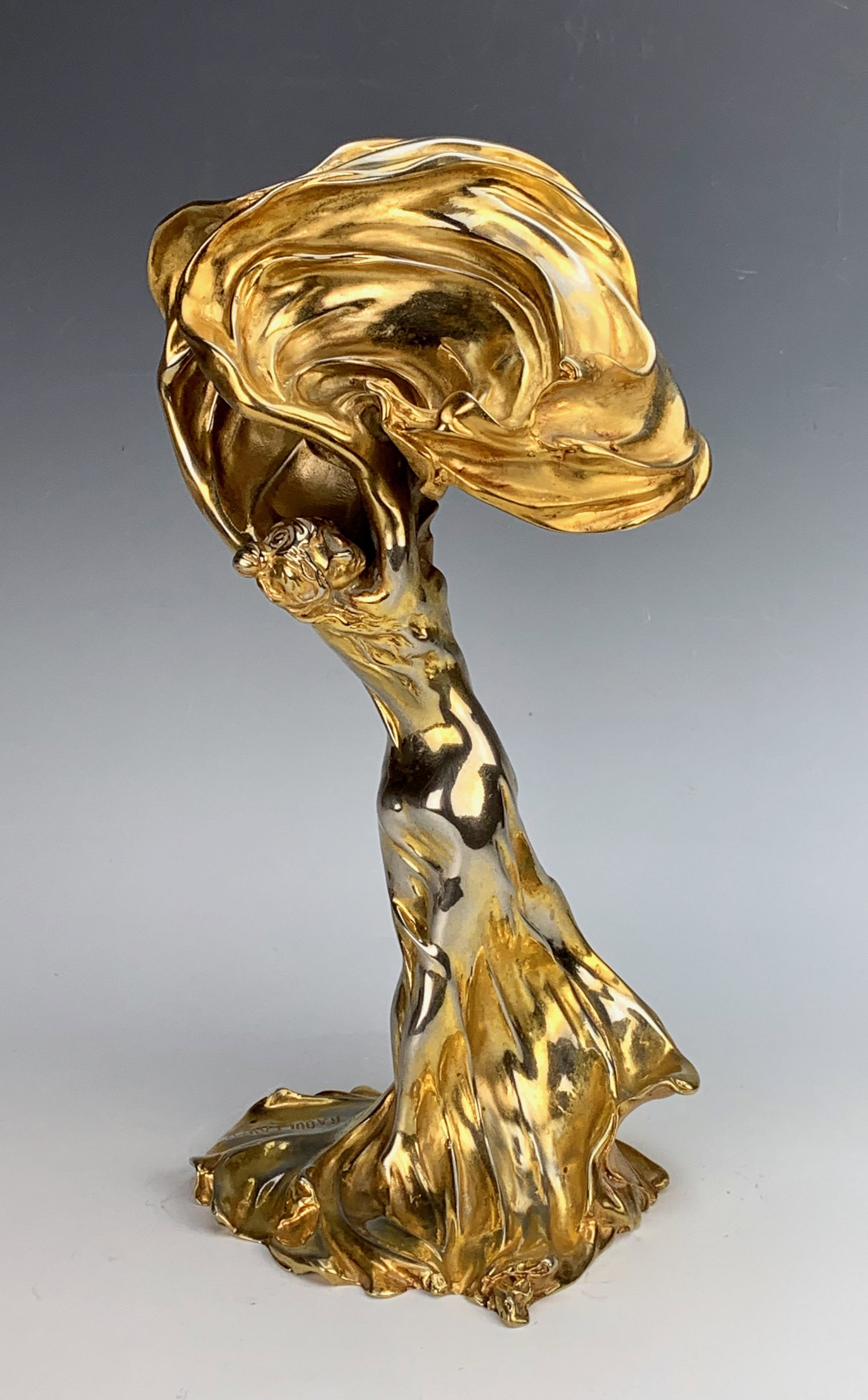 Loie Fuller Gilt Bronze Table Lamp: A gilt bronze figural lamp of Loie Fuller after Raoul Francois Larche, signed with foundry mark and Raoul Larche, uneven patina, missing electrical fittings, not old. 12.5" tall.