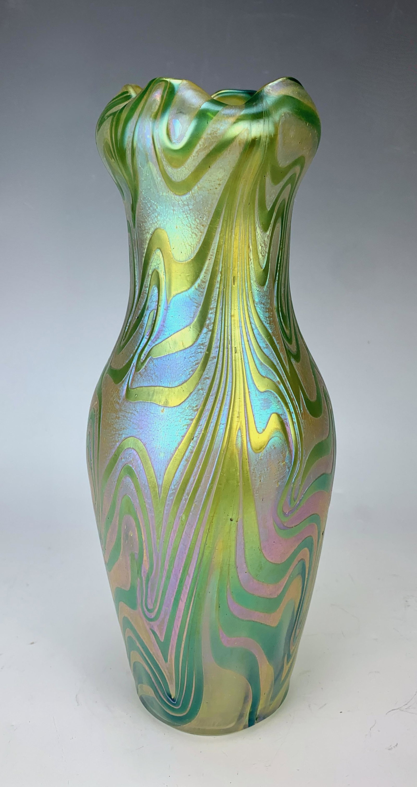 Loetz Style Antique Art Nouveau Vase: Circa 1900, a beautiful iridescent art glass vase, art nouveau Loetz type with varigated reds and greens, very good condition, 10" tall Circa 1900, a beautiful art glass vase, iridescent art nouveau L