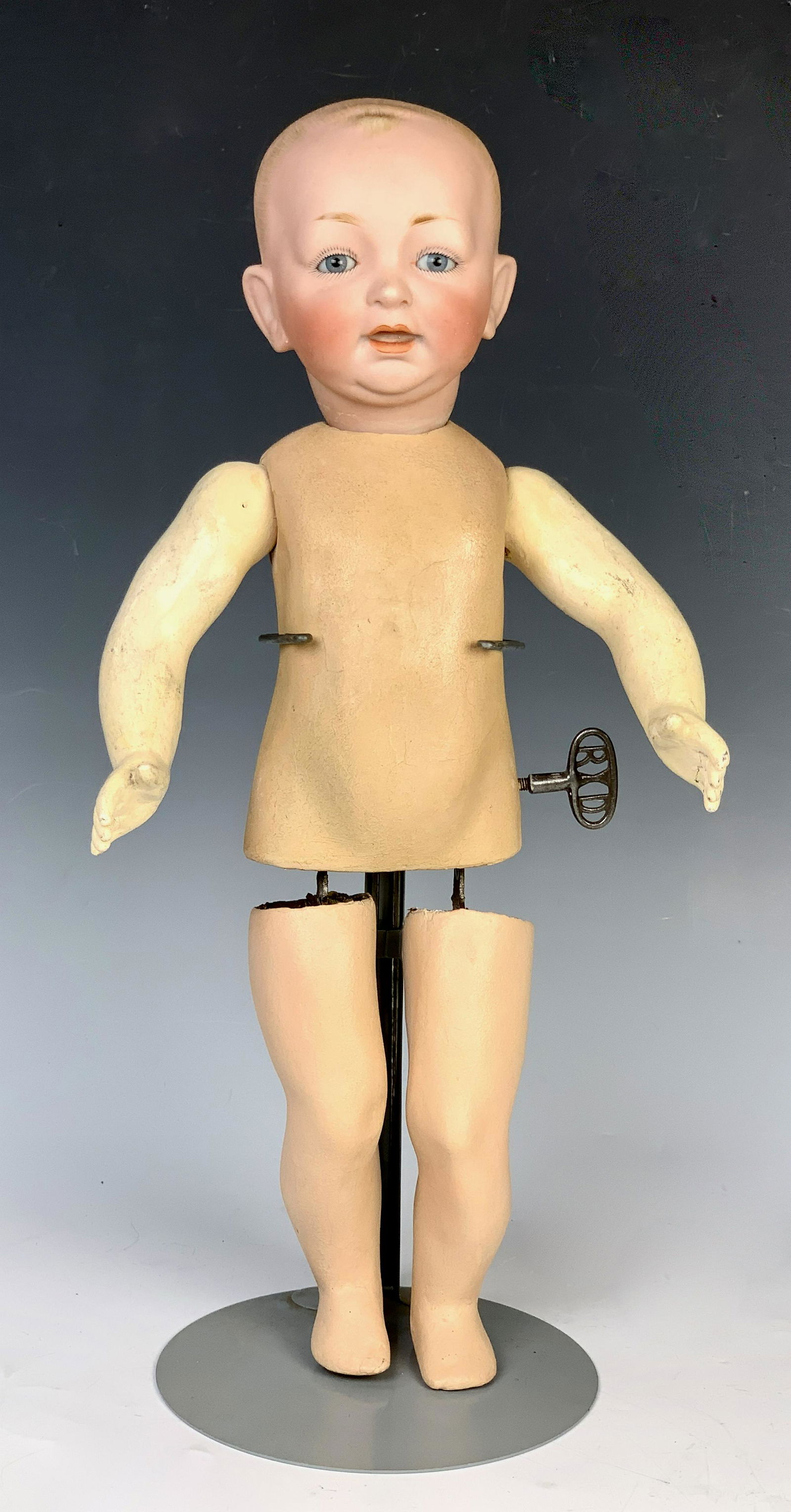 Roullet Decamps "Baby Walker" Automaton: Antique automaton by Roullet Decamps with bisque head marked "#11"and having glass eyes, purported to be a Kestner head, very good condition, works at time of auction, 16.5" tall. Visit the following