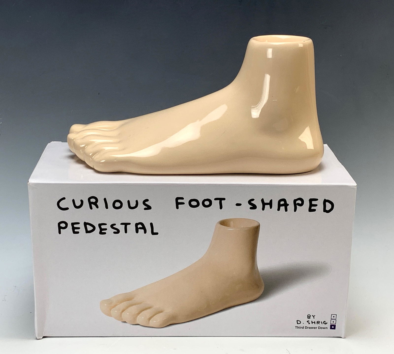 David Shrigley "Curious Foot Shaped Pedestal": Circa 2018, painted ceramic sculpture by David Shrigley, signed and titled on bottom with box, like new conditin, 9" x 4.5"