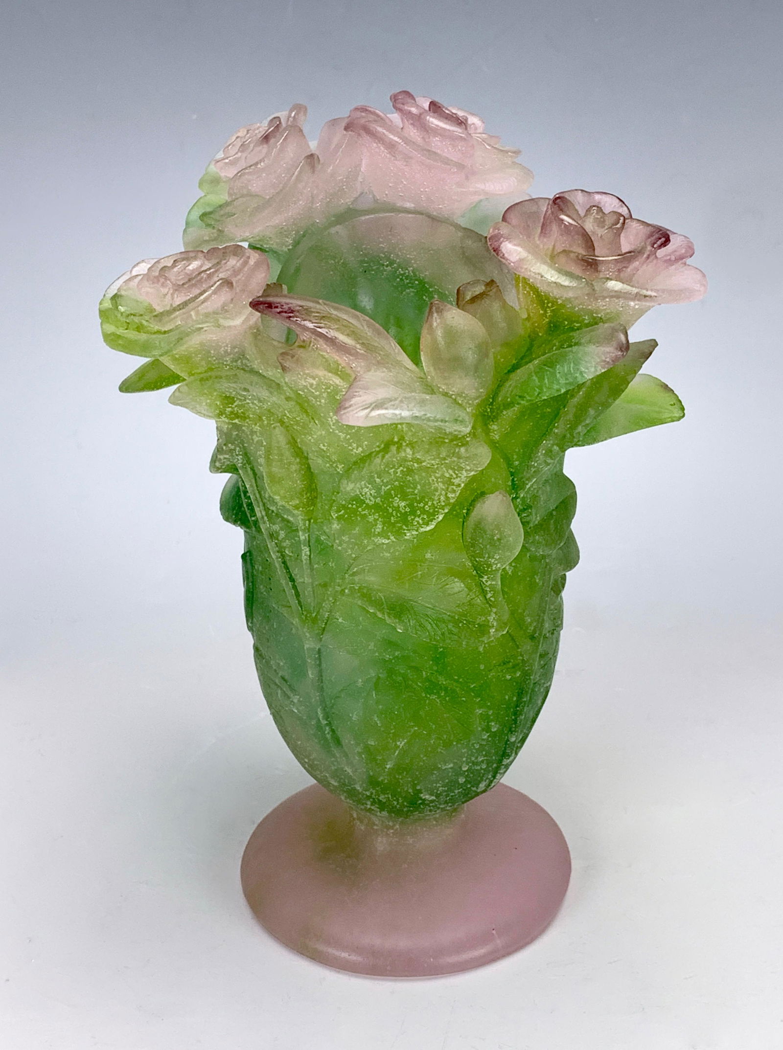 Daum France Pate de Verre Floral Vase: Fine example of a signed Daum France pate de verre glass vase having a pink frosted foot flaring out in green frosted body topped with a group of pink and green flowers, very good condition, 7.25" hei