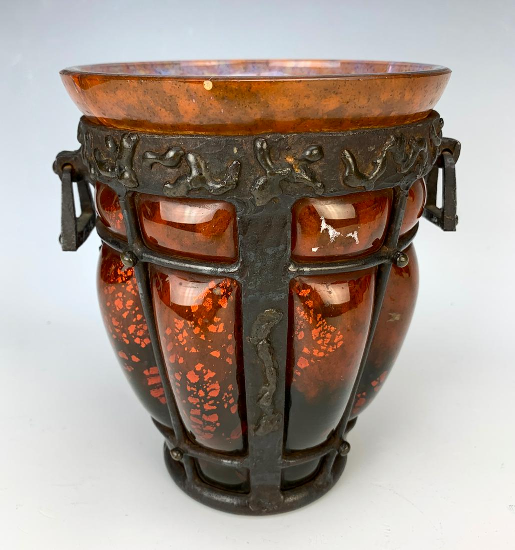 Daum Nancy & Majorelle Art Glass & Iron Vase: Circa 1920, having a signed Daum Nancy and L. Majorelle art glass vase in red with gold flake details mounted with wrought iron exterior, made in France, has 2 cracks, 6.875" height