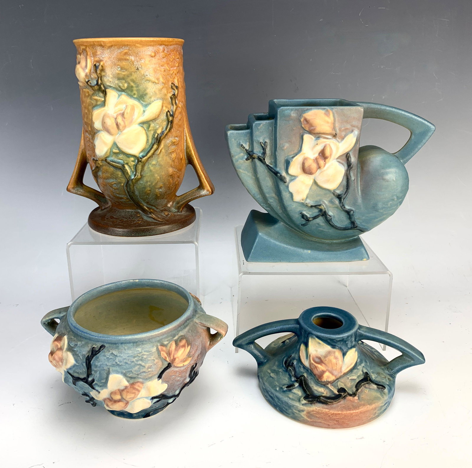 Group of 4 Roseville "Magnolia" Pottery c.1943: Including DBL bud vase, candlestick and vase, and flower frog. 9" widest. Very good condition