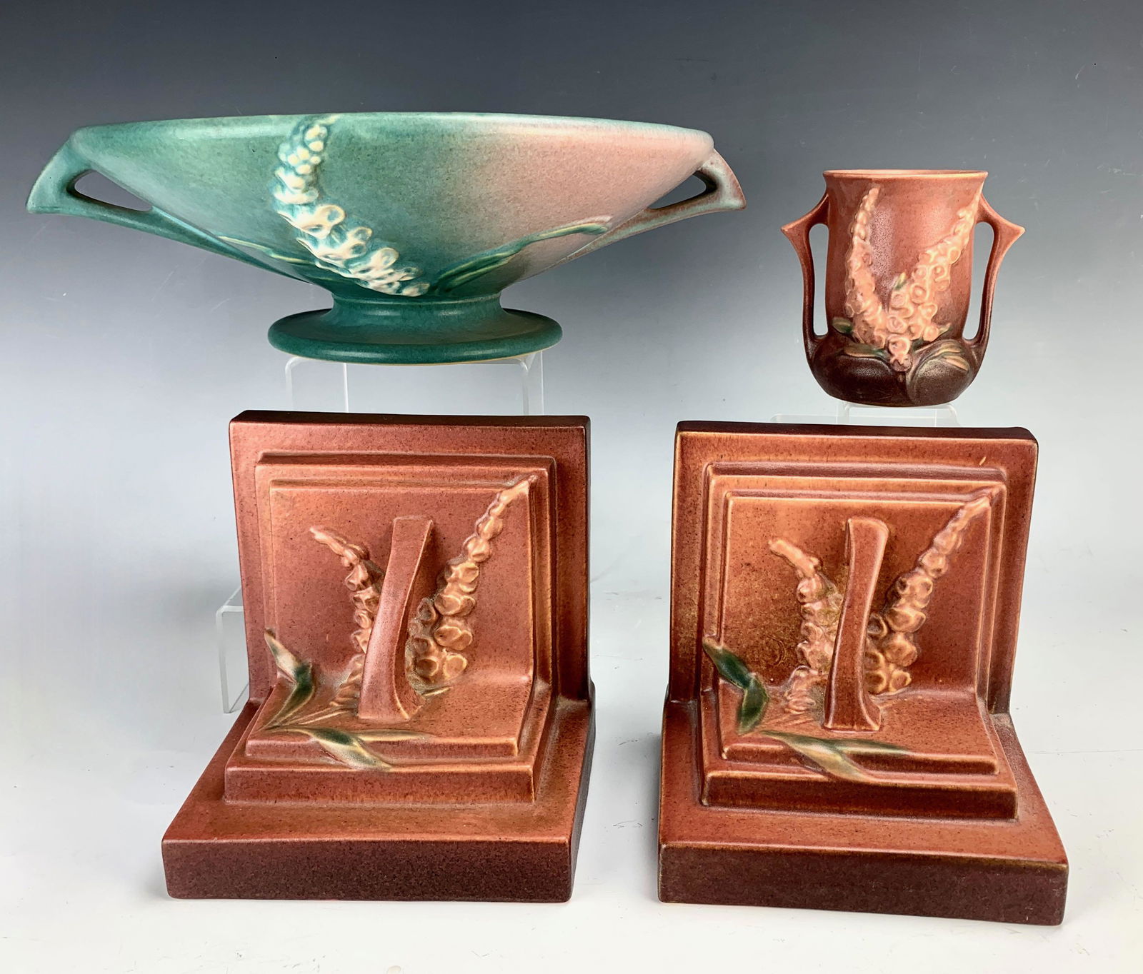 Group of 4 Roseville "Foxglove" Pottery C. 1942: Includes pair bookends, one cornucopia and vase, and one bowl. 10" tall. Good condition.