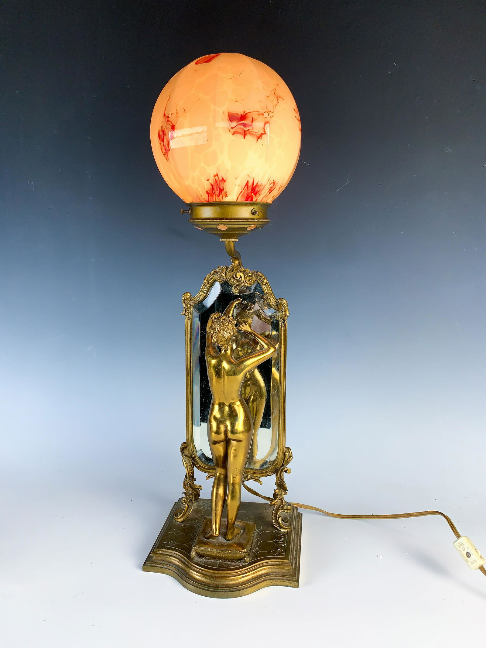 Emile Pinedo (1840-1916) Bronze Nude Mirror & Lamp: Wonderful gilt bronze depicting a nude female standing before a cheval mirror, raised on a shaped base. Also, has a standard lamp with ball shade. Signed on base "Pinedo". Provenance: Palm Springs Est