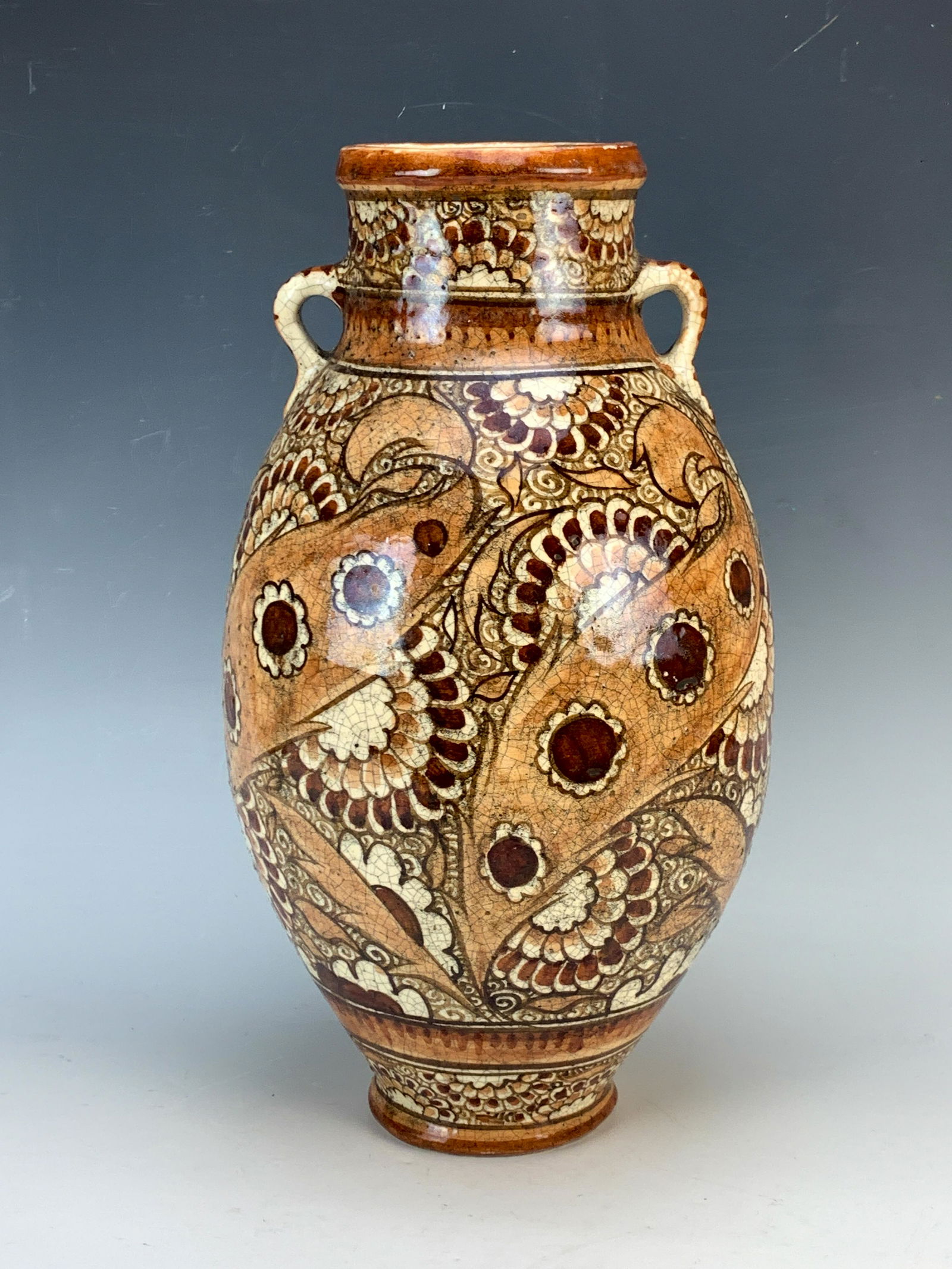 Jean Jacques Lachenal (1891-1945) Pottery Vase: Having a tall ovoid shaped pottery vase with two attached handles. Decor in shades of brown geometrics, in the Iznik taste. Signed on bottom "Lachenal". Size: 15" tall x 8" wide. Condition: good.