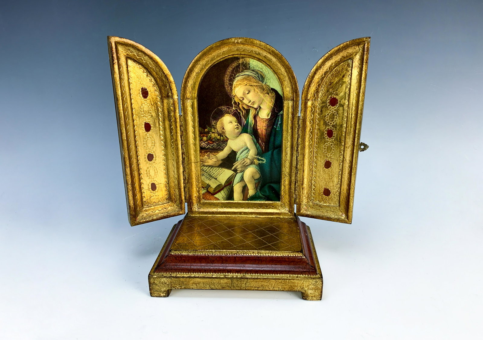 A Swiss Musical Triptych Mother & Child: The item measures 9 1/2" high by 6" wide. The music is Ave Maria by Schubert. In very good working condition.